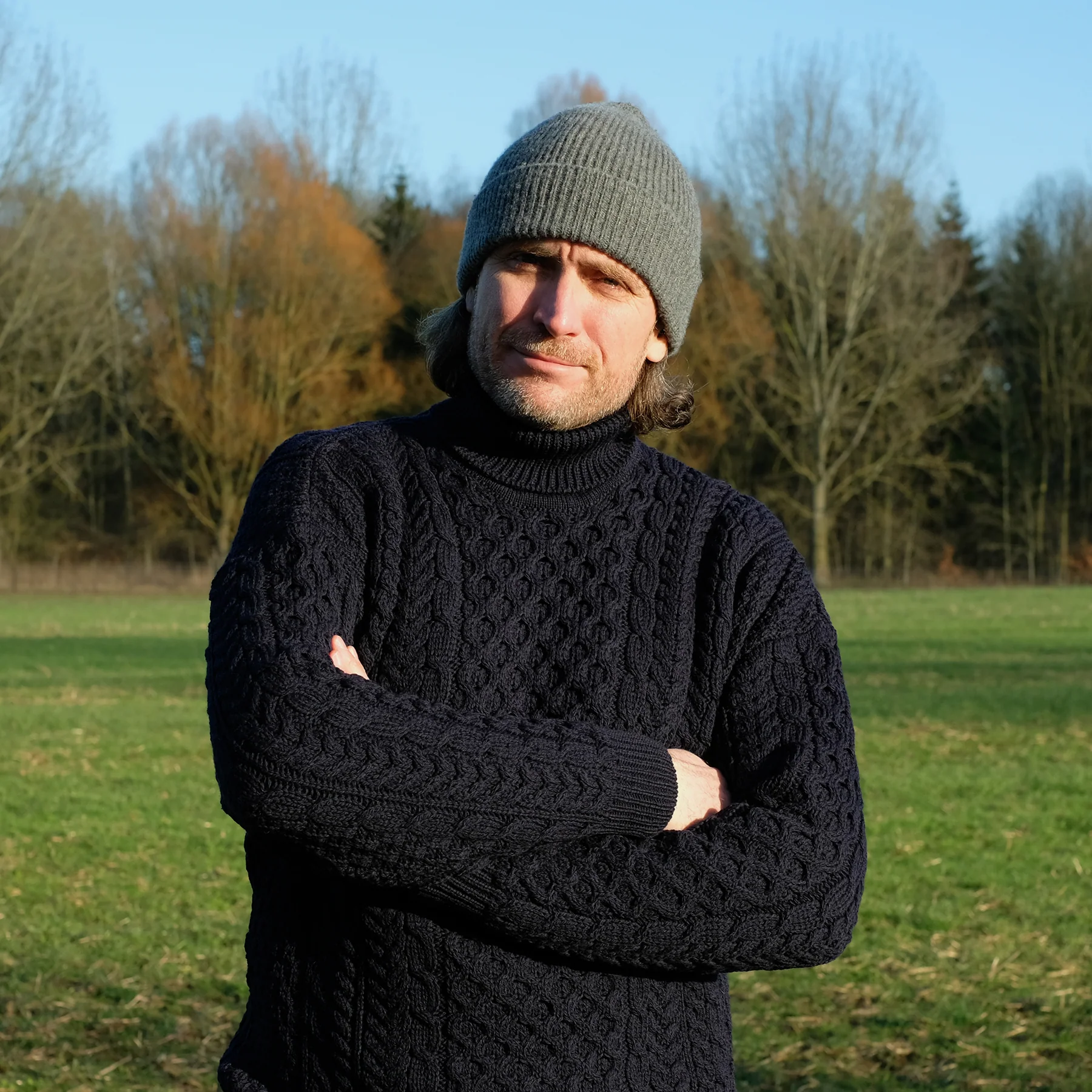 Traditional Aran polo neck sweater in Navy - Image 3