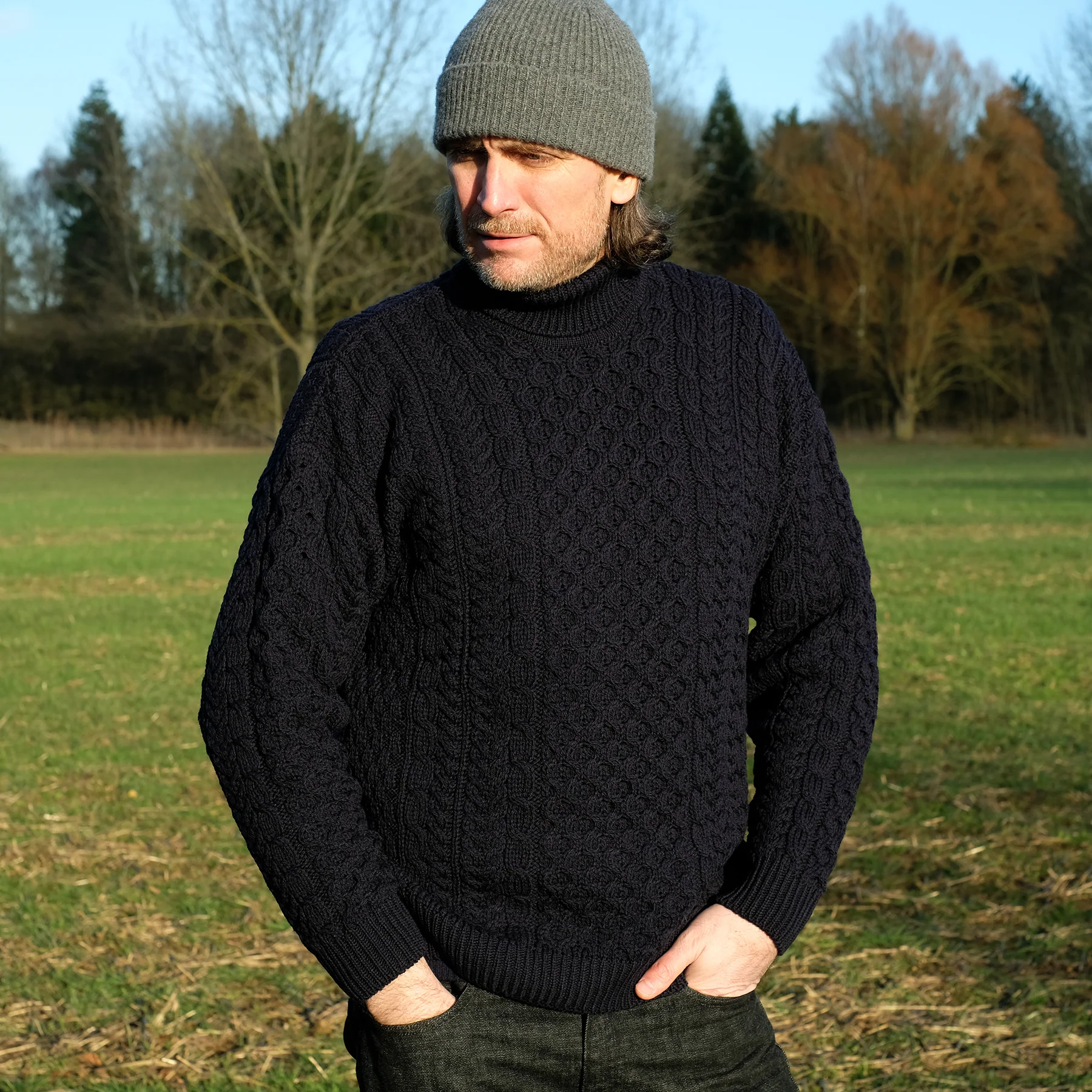 Traditional Aran polo neck sweater in Navy - Image 4
