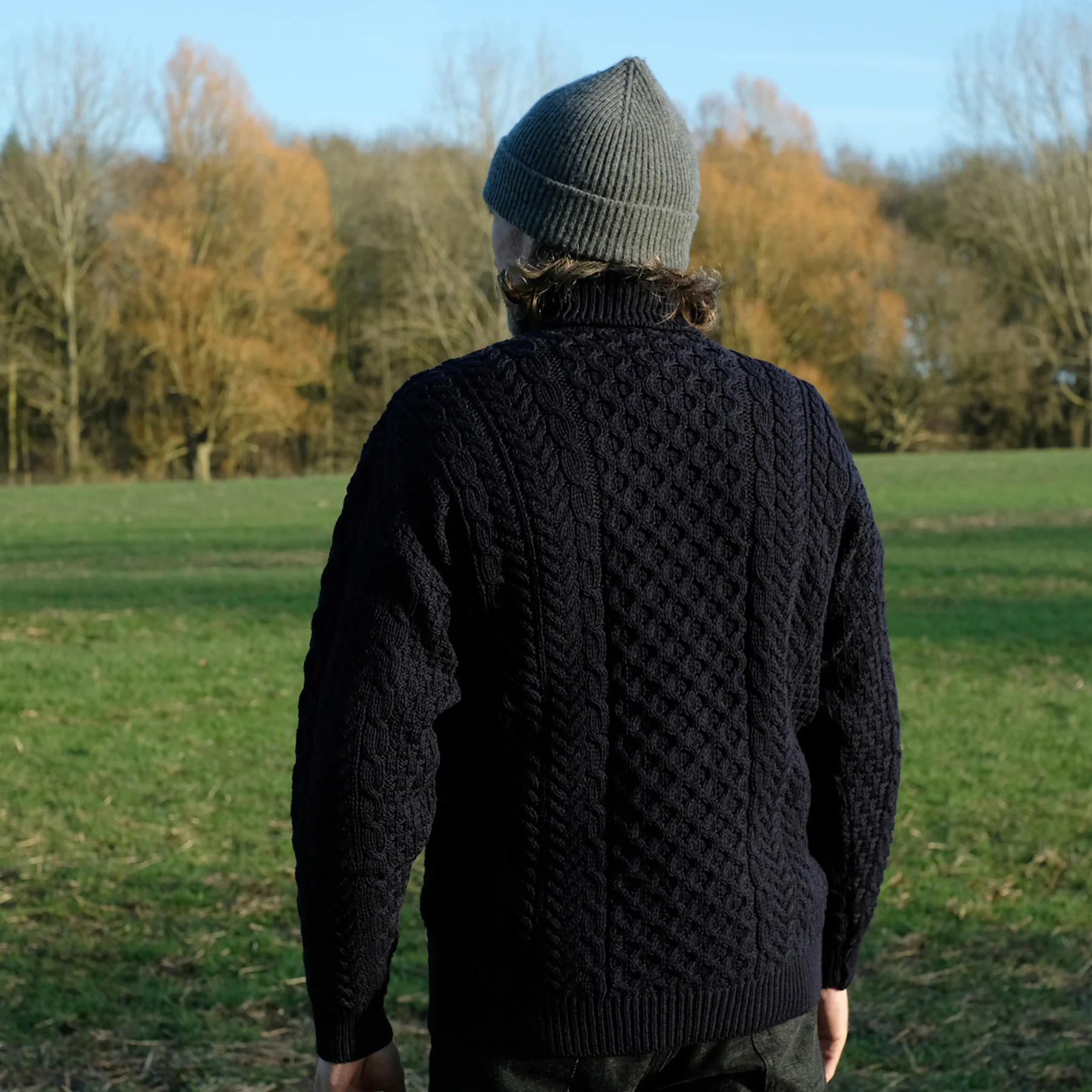 Traditional Aran polo neck sweater in Navy - Image 5